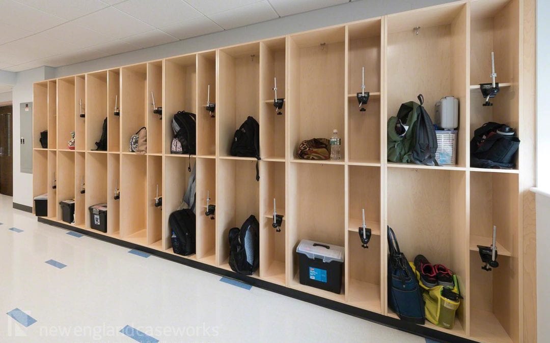 Classroom Backpack & Coat Storage Backpack and coat storage is a common entryway structure that consists of tall open compartments with coat hooks for easy access. Contact us at https://newenglandcaseworks.com/casework-millwork/specialty-casework/classroom-backpack-storage/ to assist in designing classroom storage that best fits your needs!